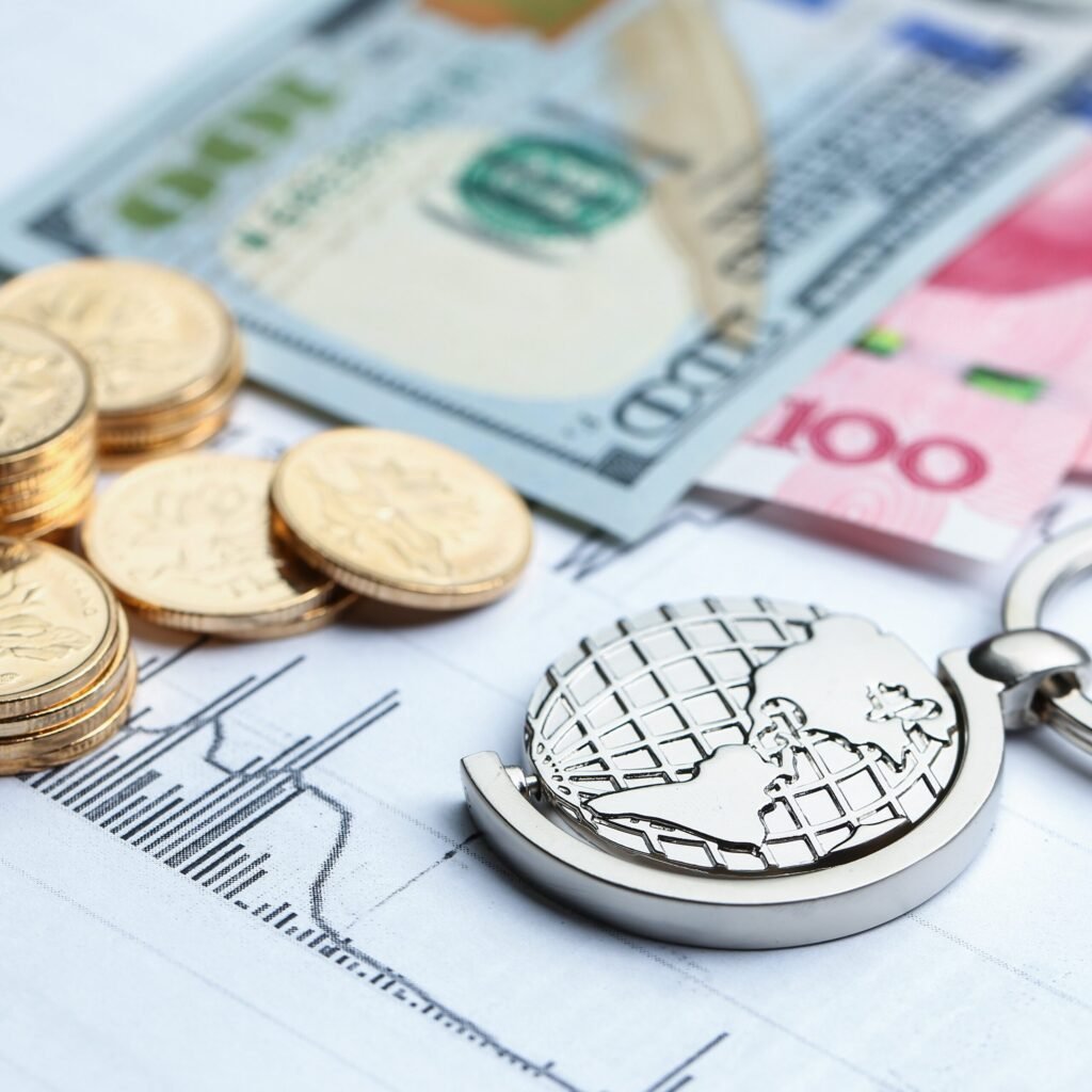 Coins, paper money and globe on white Statistic form background Coins, paper money and globe on white Statistic form background